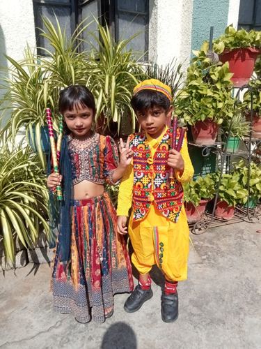 Child in colourful traditional fancy dress costume